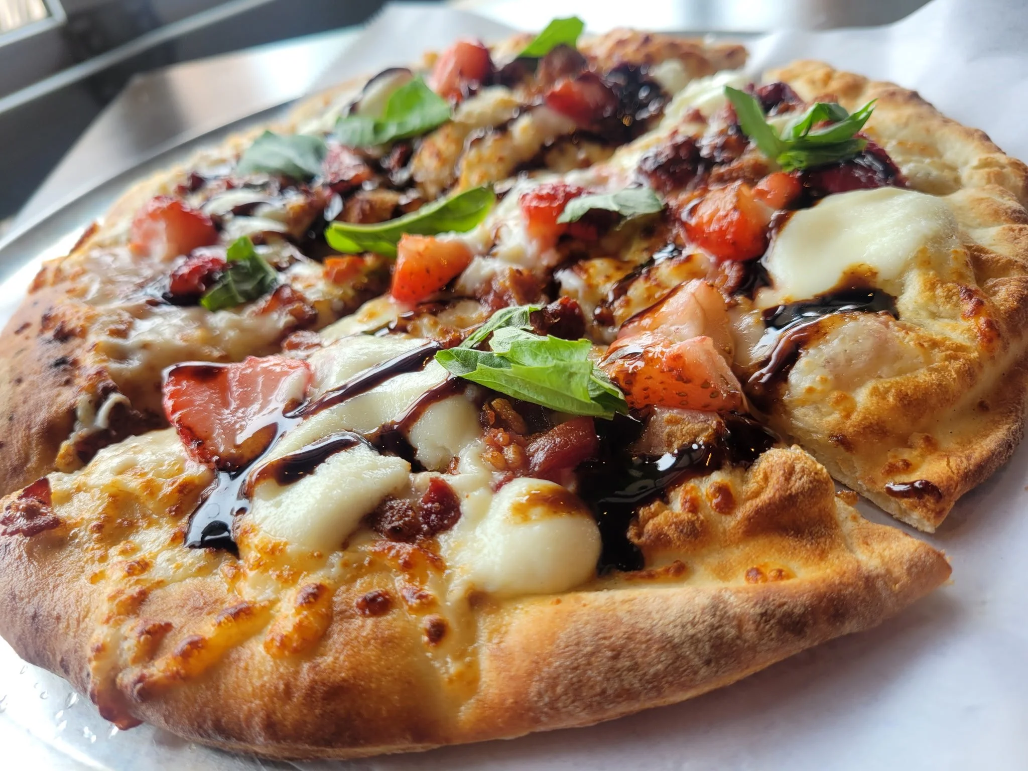 🍓🍓It's back! For a limited time, the famous Strawberry Balsamic Pizza is here. Come in and try this refreshing Oven classic. See you soon!🍓🍓
