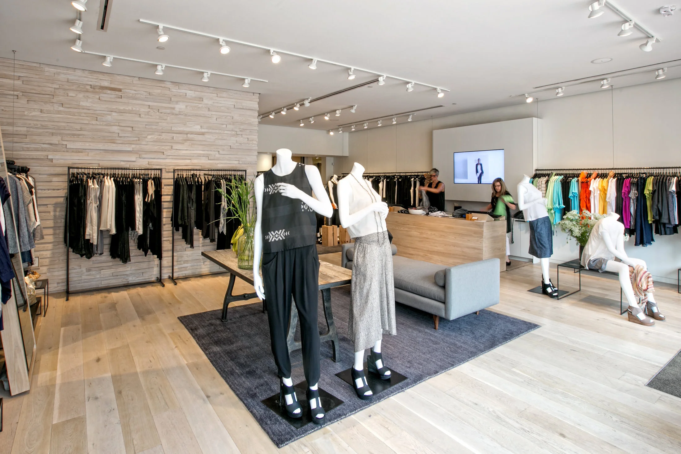 Warm wood and stone create an elegant look for Eileen Fisher’s Country Club Plaza retail store remodel