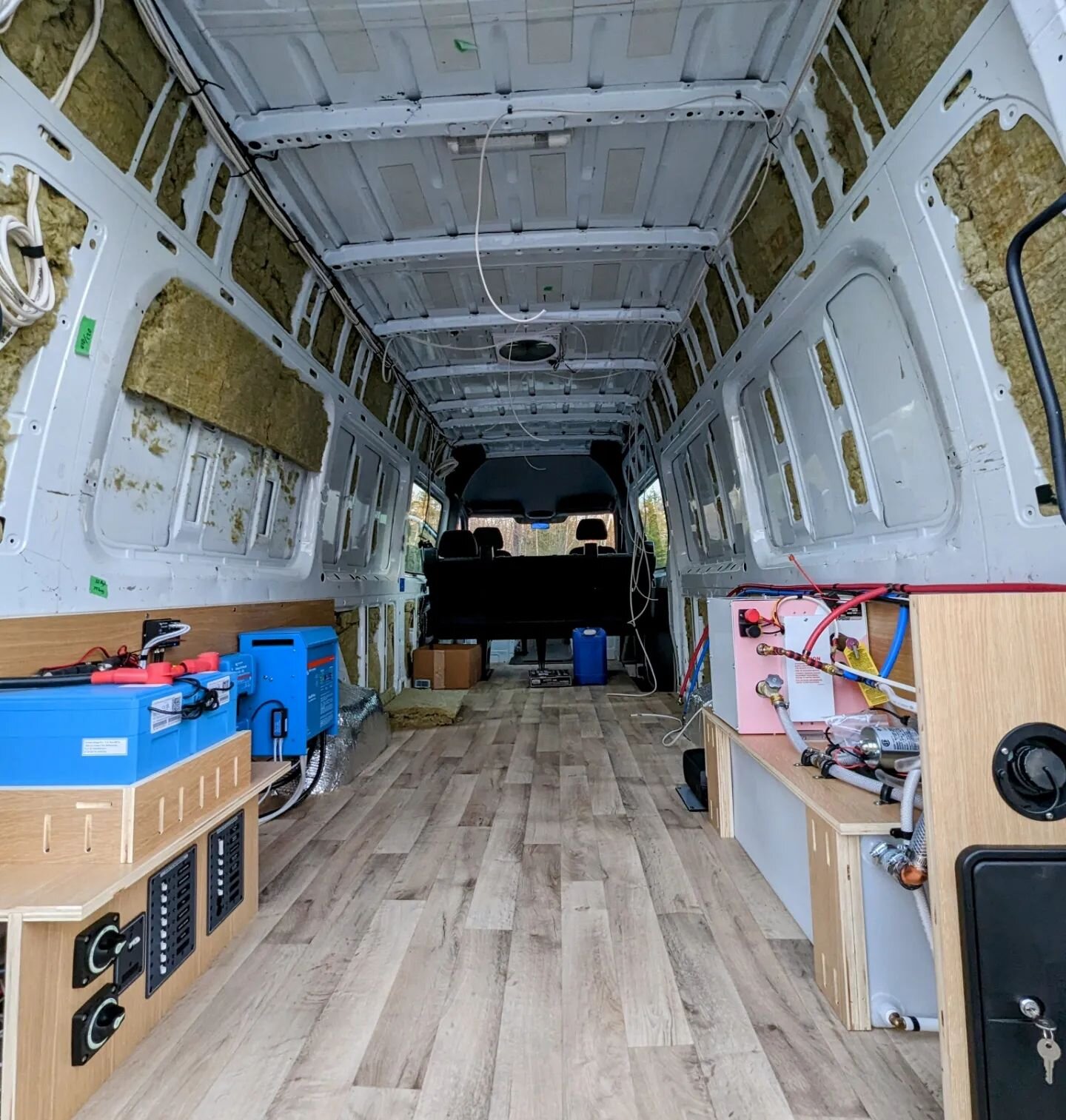 DIY Collaboration Project: 
The owners insulated their van and installed their own floor. Ray Outfitted the van with a MaxxAir fan, a robust off grid electrical system with solar, alternator and shore power charging capabilities, an Eberspaecher dies