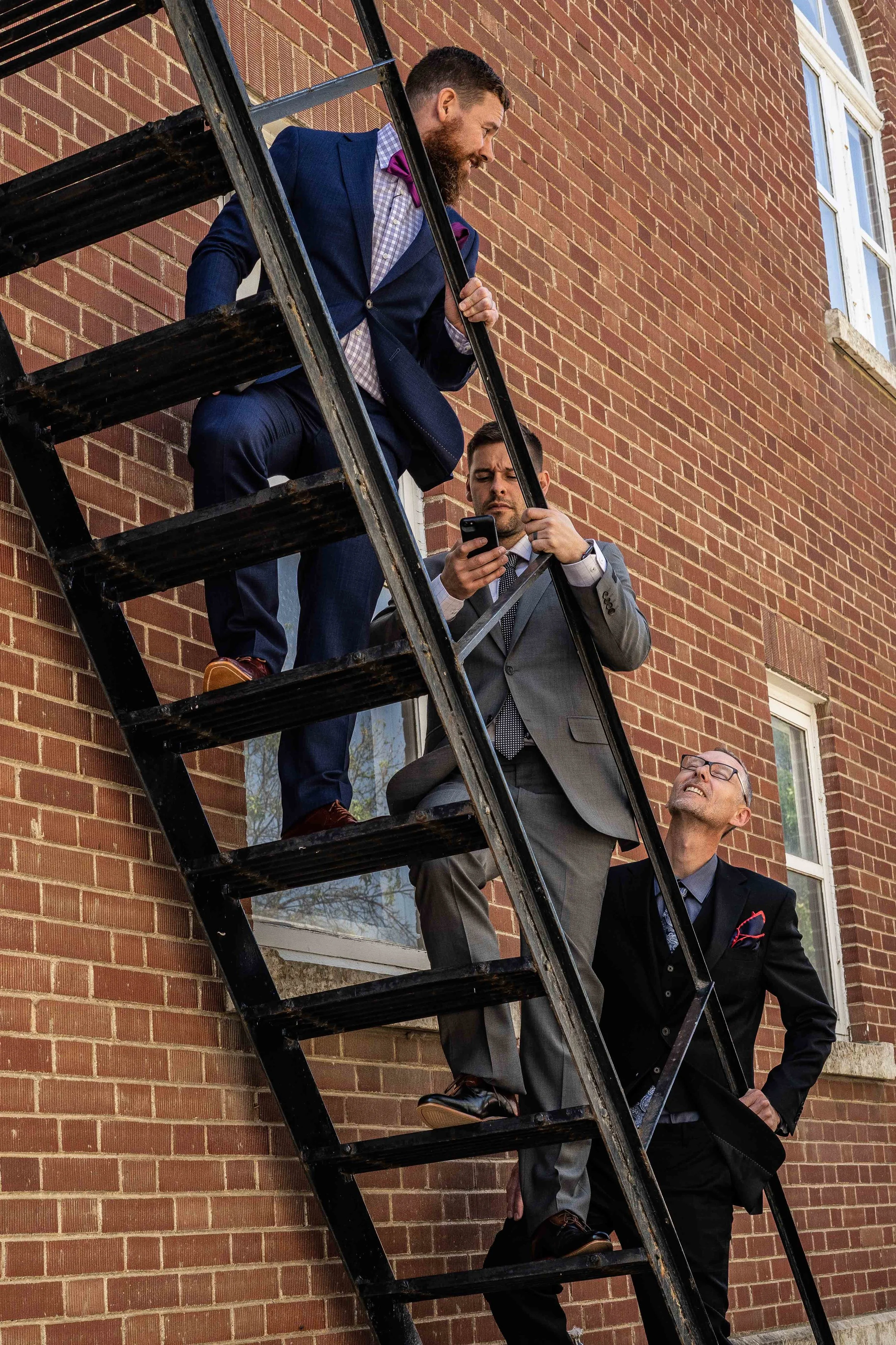 red guys up fire escape.jpg