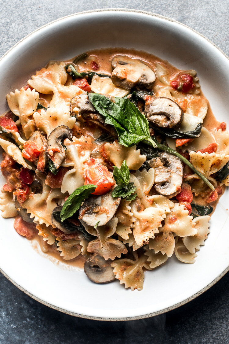 Farfalle Pasta With Spinach And Mushrooms In A Creamy Tomato Sauce Flourishing Foodie