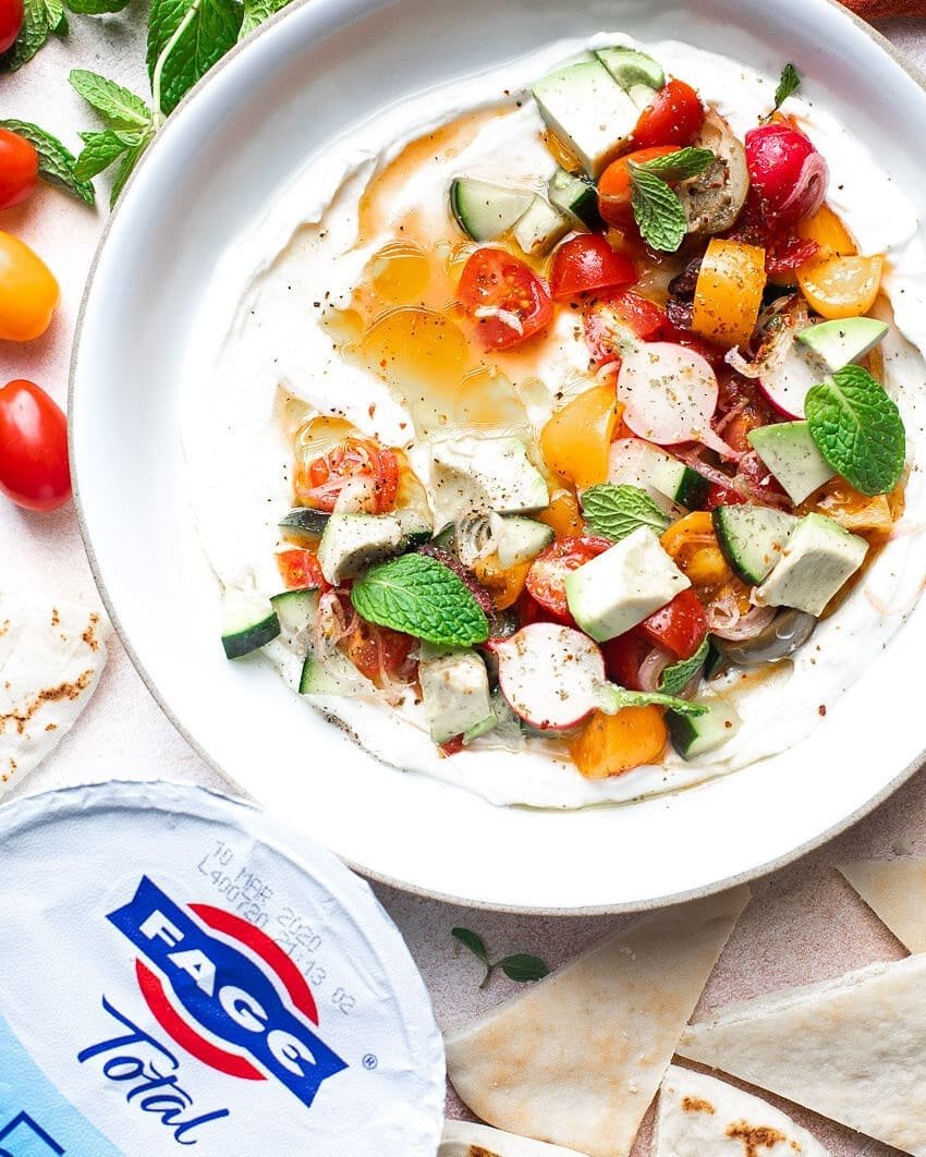 #sponsored Savory Yogurt Bowl with creamy @FAGE Total 5% Plain and FAGE Total 2% Plain Greek yogurt, tomatoes, cucumber, olives, avocado, radishes, shallots, fresh mint, olive oil, lemon juice, and spices. Serve it with warm pita bread on the side an