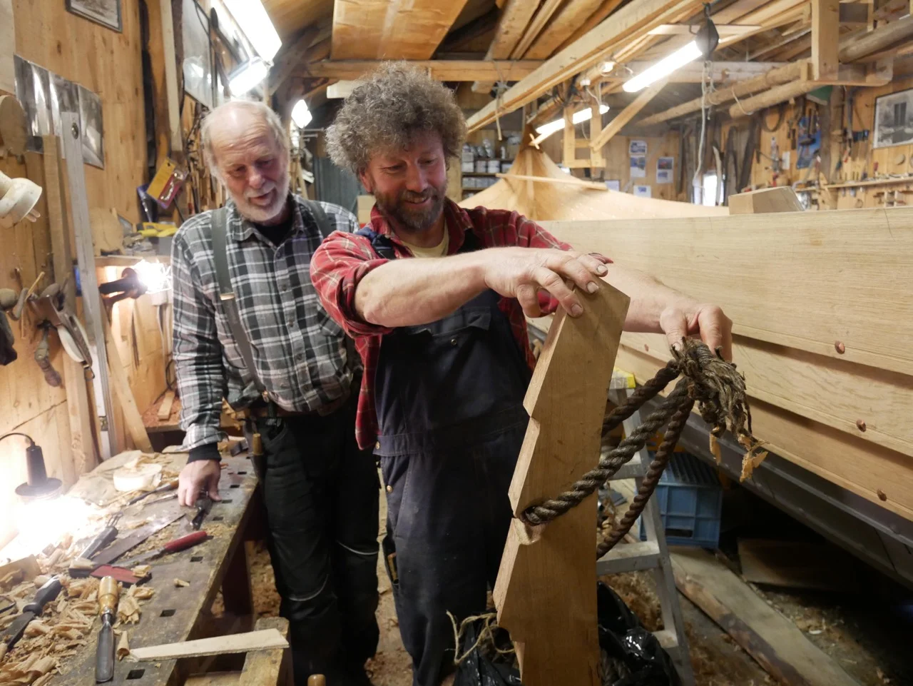 Gunnar and Arne-Terje checking the fit of the line on the frame I carved.