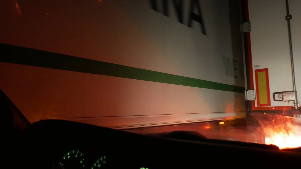 Ahh - real life claustrophobia test. Two semi-trucks slowly passing one another, our dashboard in the foreground. 