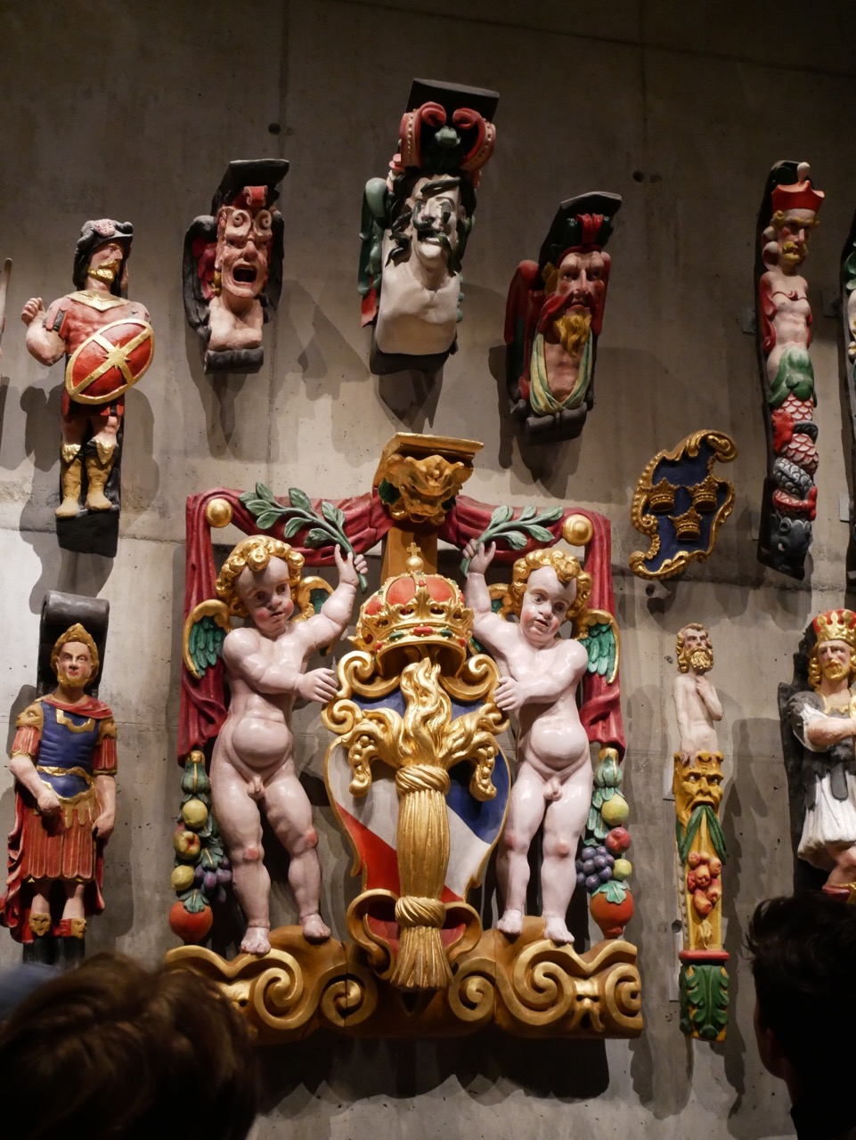 An approximation of what some of the ship's carvings would have looked like with their original colors.