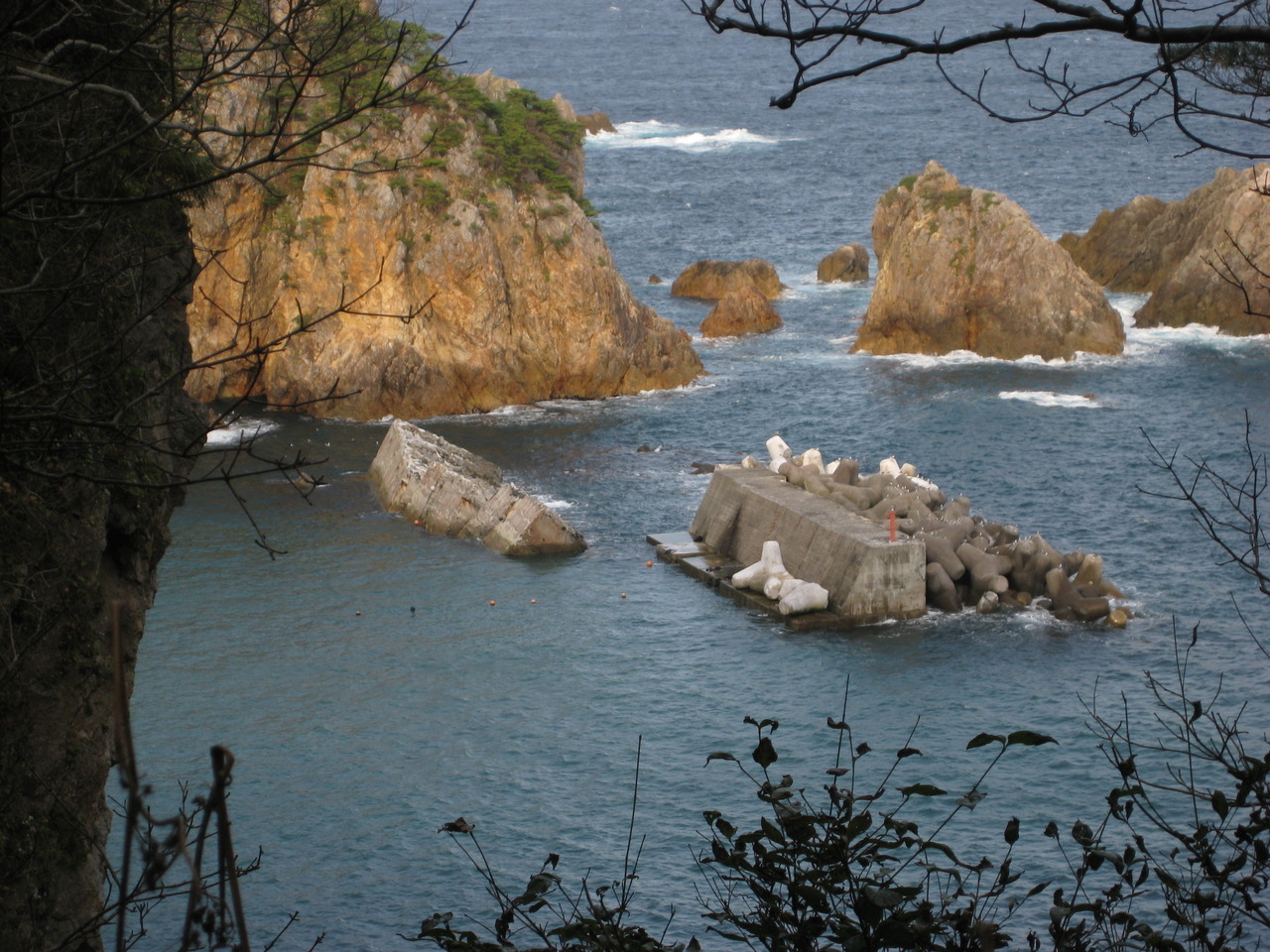 The overturned breakwater wall serves as evidence of the power of the 2011 tsunami.