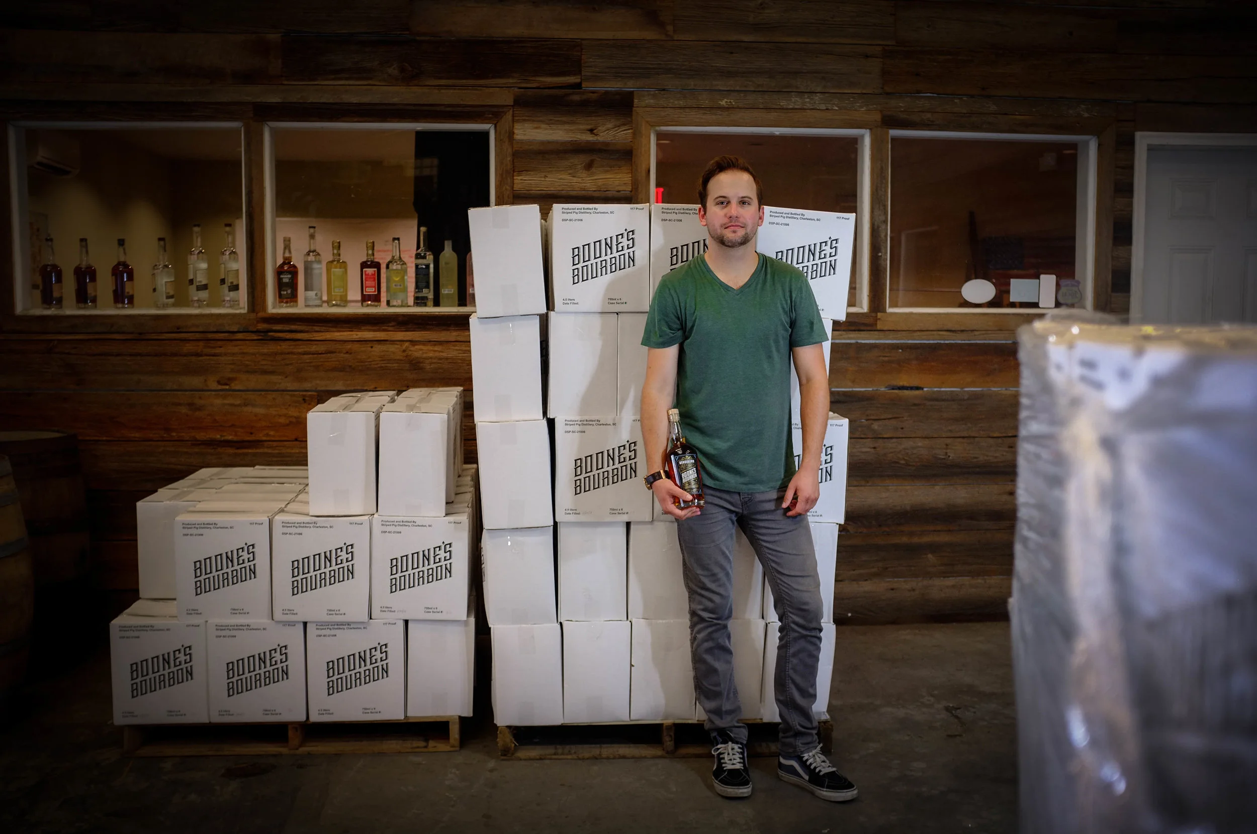 tyler+boone+ in front of cases.jpg