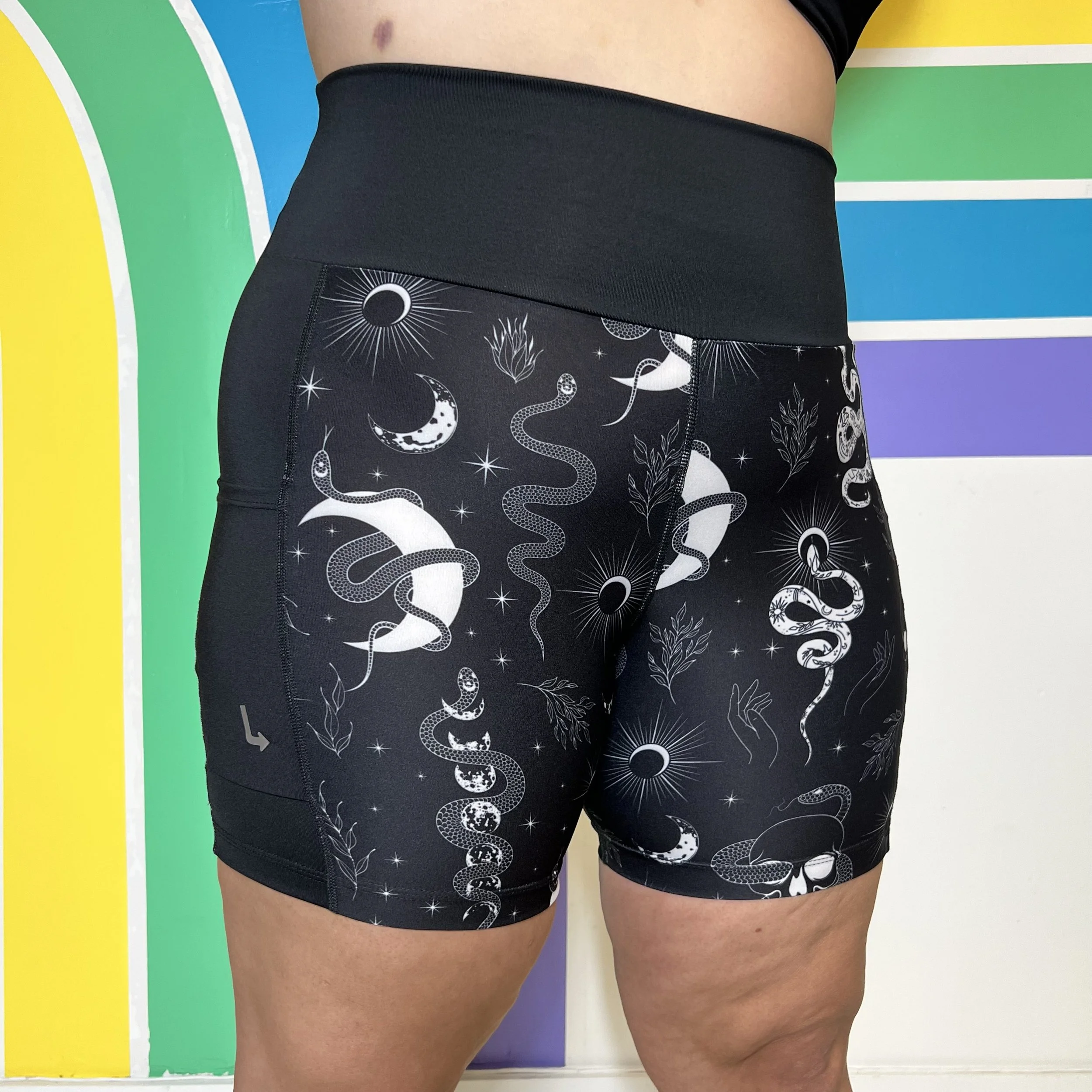Front view of occult-themed pocket shorts by left turn clothing.