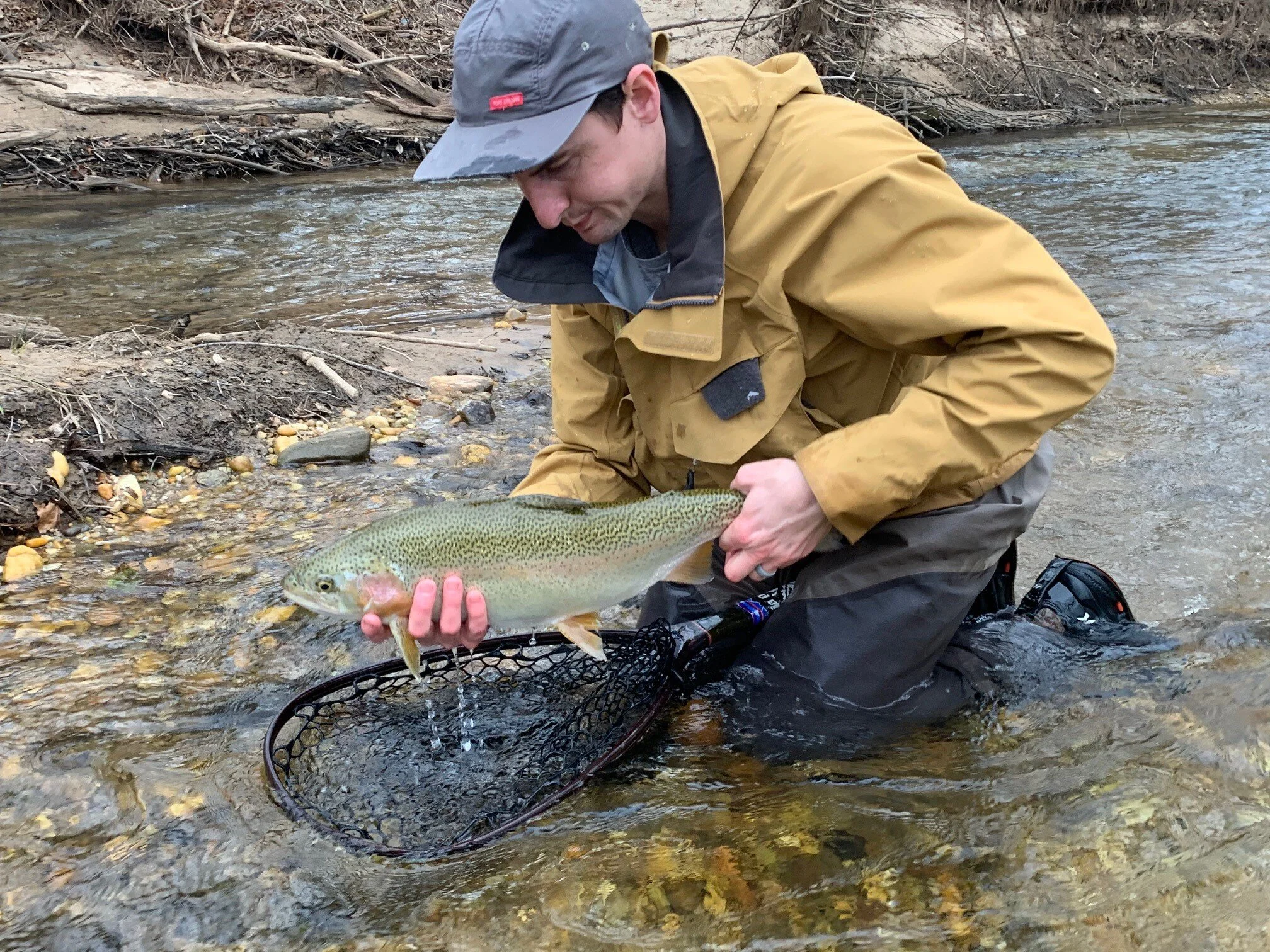 Kyle releases a 22” rainbow in the Soque River