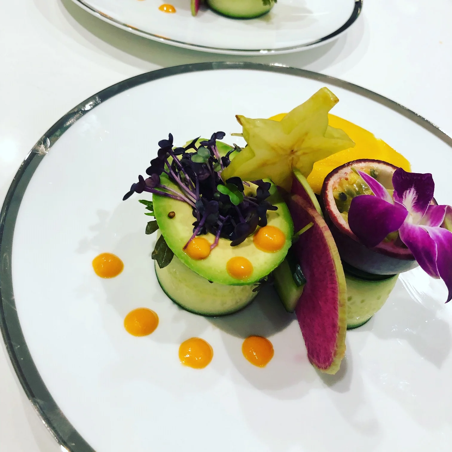 Tropical Asian Salad of Cucumber Ribbons, Watermelon Radishes, Purple Baby Mizuna, Tropical Fruit, and a Papaya Sesame Vinegrette