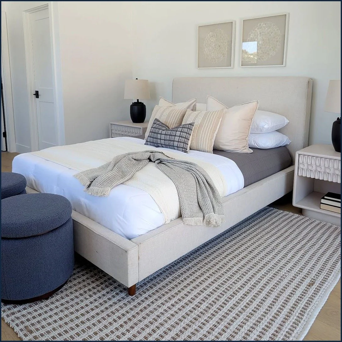 Point Loma staged guest bedroom with an upholstered headboard and layered coastal bedding
