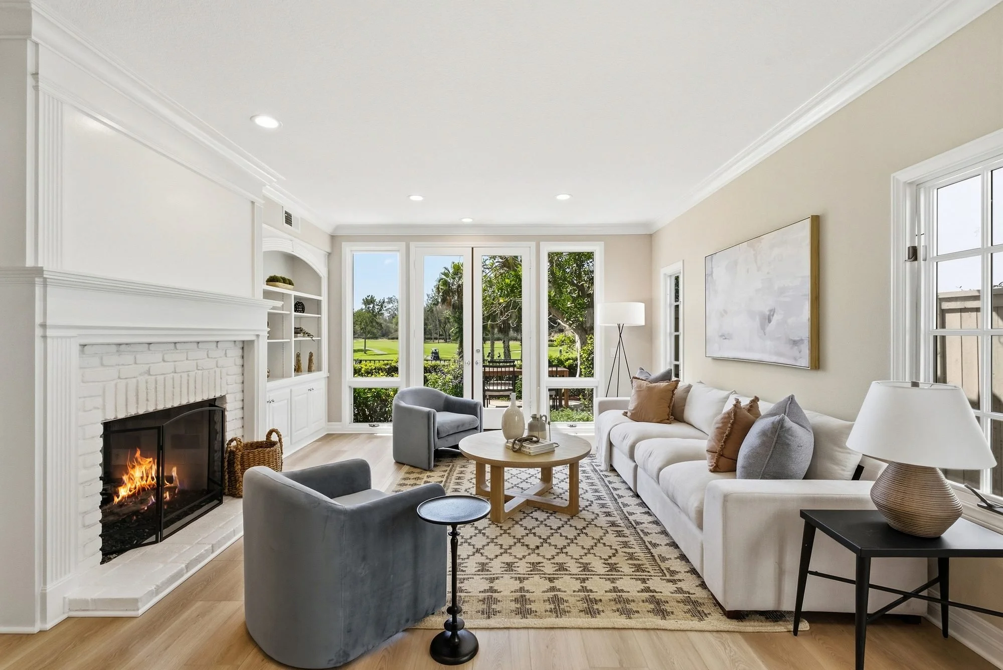 Staged living room with fireplace and garden doors, a CASA BY CRAFT San Diego home staging project