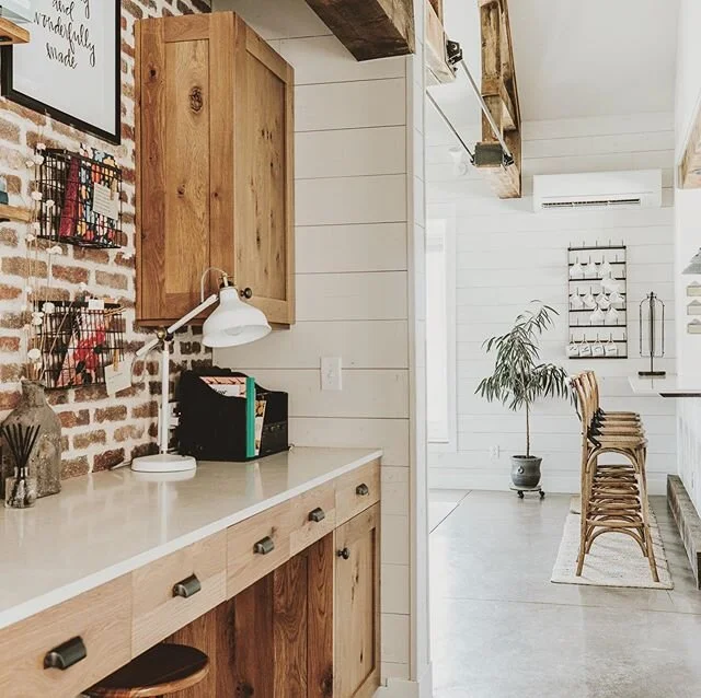 It was important to me to make this long hallway functional and esthetically pleasing. We captured a small amount of space from the master bedroom and created this invaluable command center. Having a system to organize all the chaos from the day was 