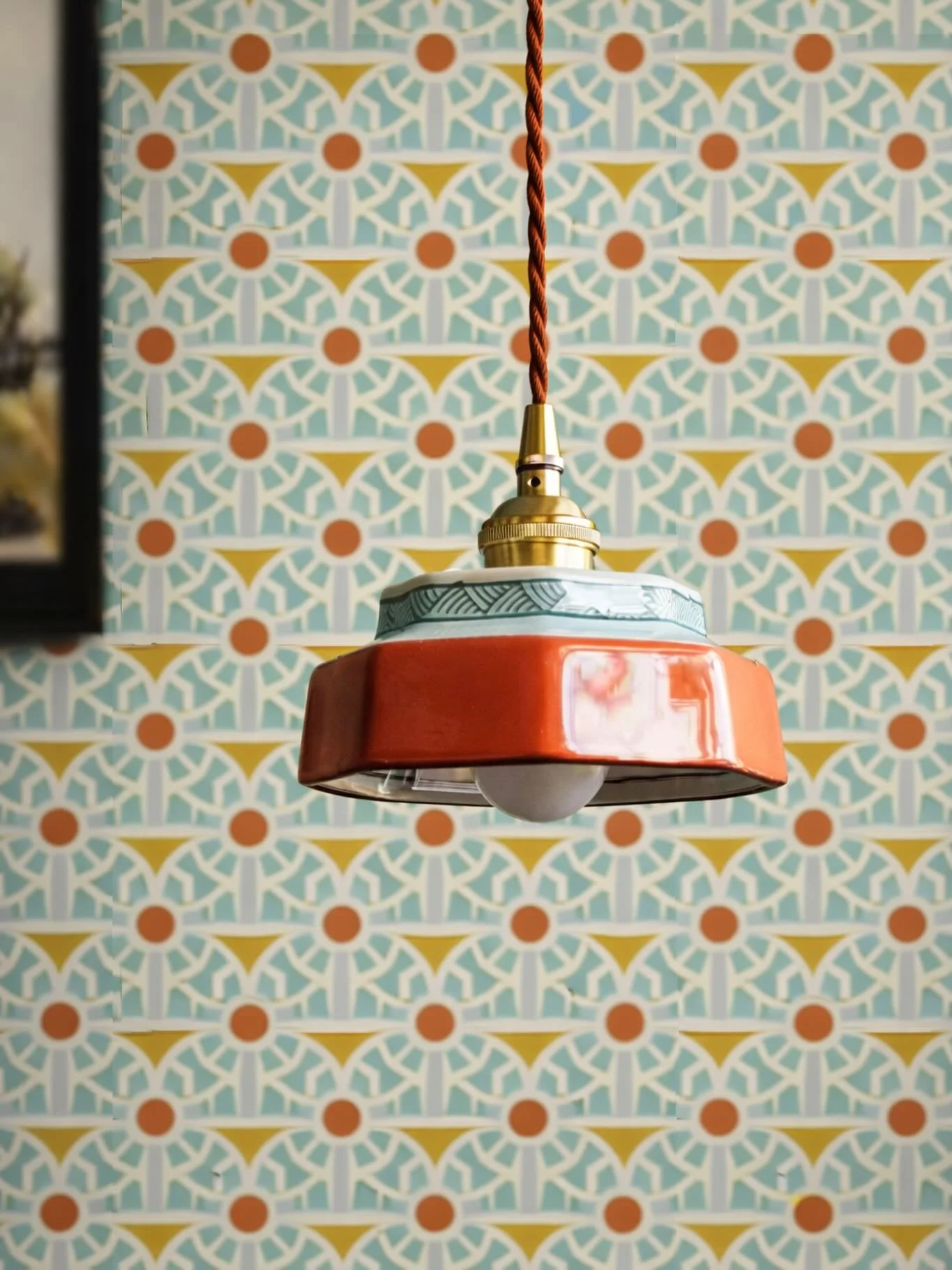 Retro geometry meets modern warmth. This wallpaper balances structured pattern with soft movement, using a palette of teal, burnt orange, and cream to keep it both bold and livable.

It adds character without overwhelming the space&mdash;perfect for 