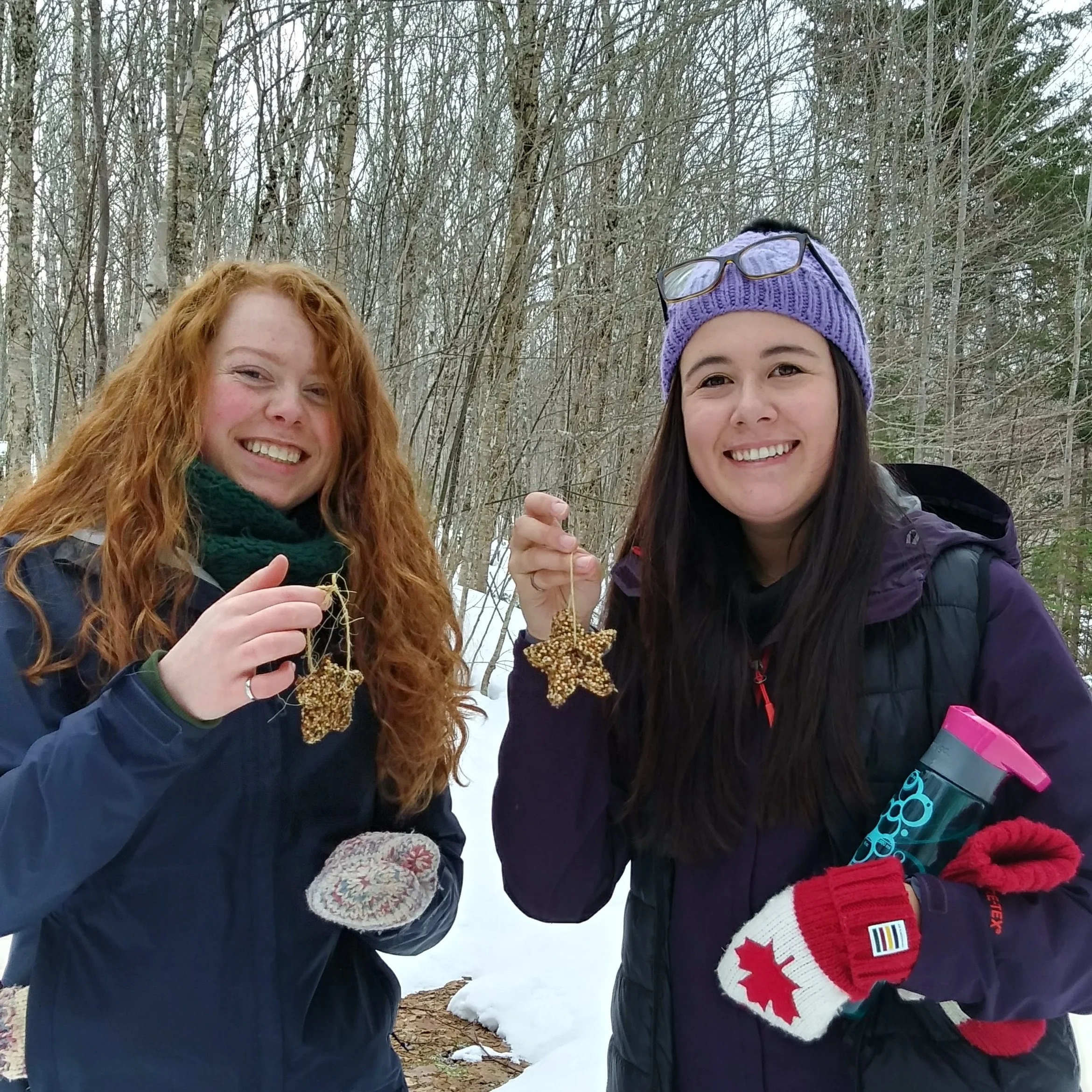 ASPIRE trainees Aidan and Nicole showing off their birdseed ornaments.