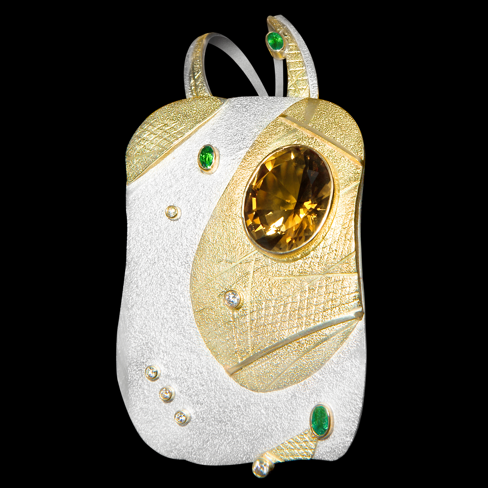 FRIDA | Fine Jewellery. Shield™ Collection, Lagertha pendant. One-of-a-kind pendant in sterling silver and 18kt yellow gold set with a faceted citrine, emeralds and brilliant-cut diamonds.