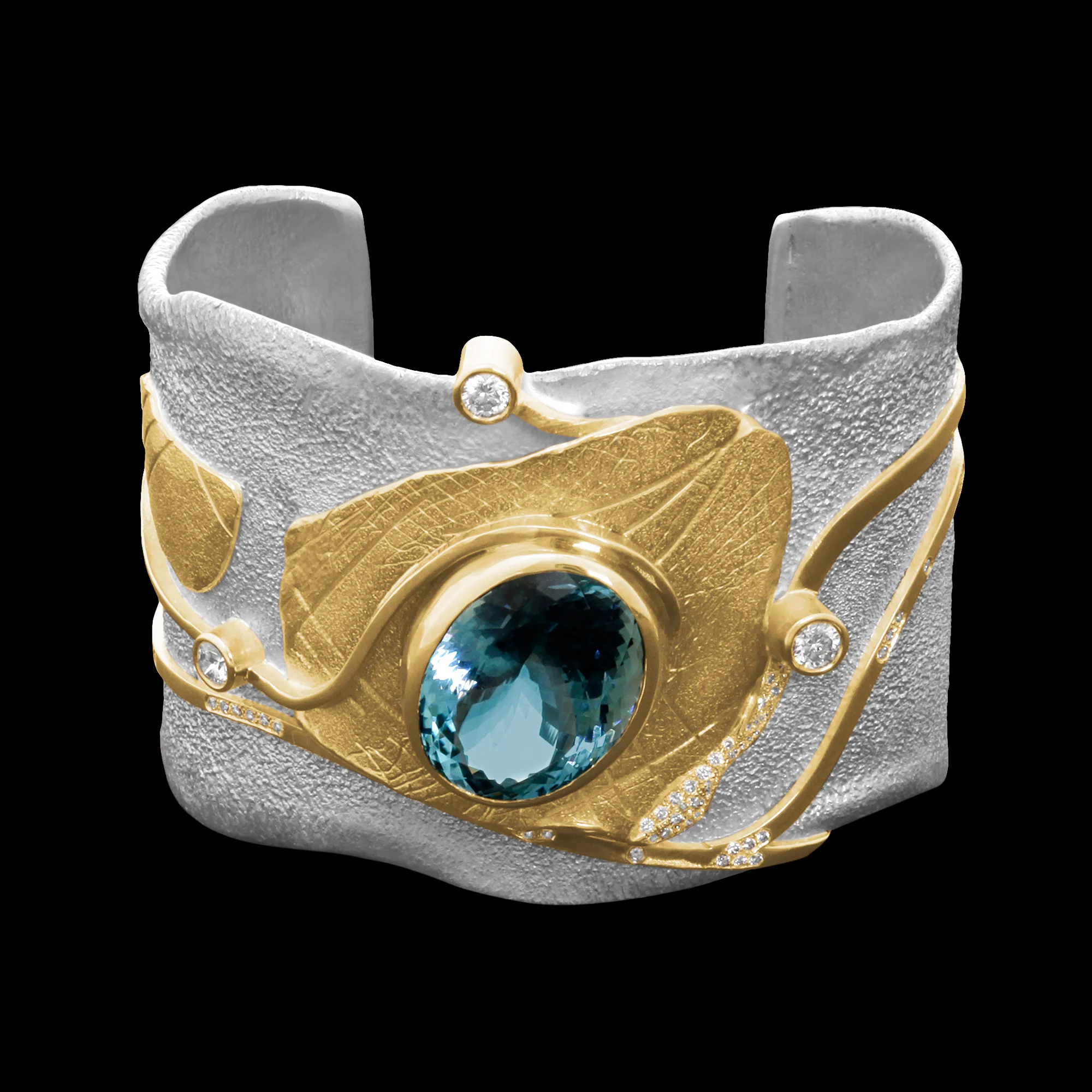 FRIDA | Fine Jewellery. Shield™ Collection, Astrid cuff. One-of-a-kind cuff in sterling silver and 18kt yellow gold set with a faceted aquamarine and brilliant-cut diamonds. View 2.