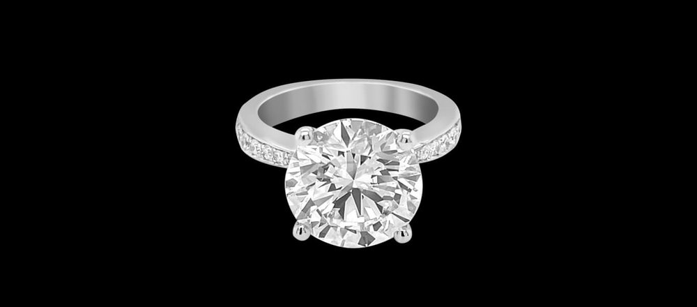 Custom 18kt white gold solitaire engagment ring with a 5ct round brilliant-cut diamond. FRIDA | Fine Jewellery.jpg