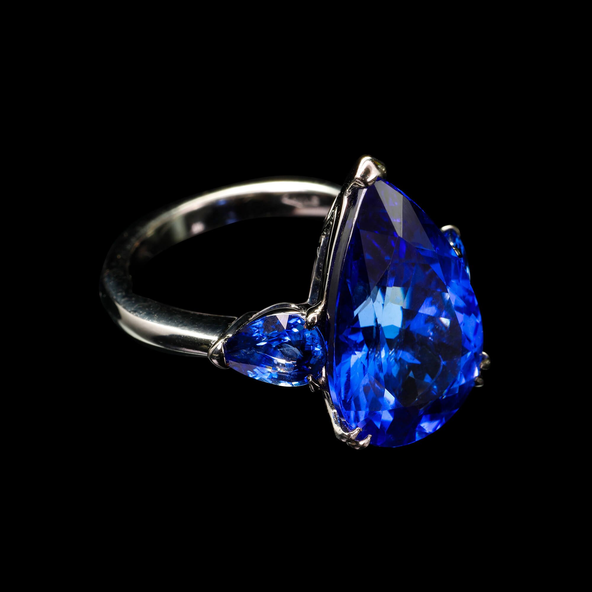 One-of-a-kind ring in 18kt gold with black rhodium with pear-shaped tanzanite and blue sapphires. FRIDA | Fine Jewellery.jpg