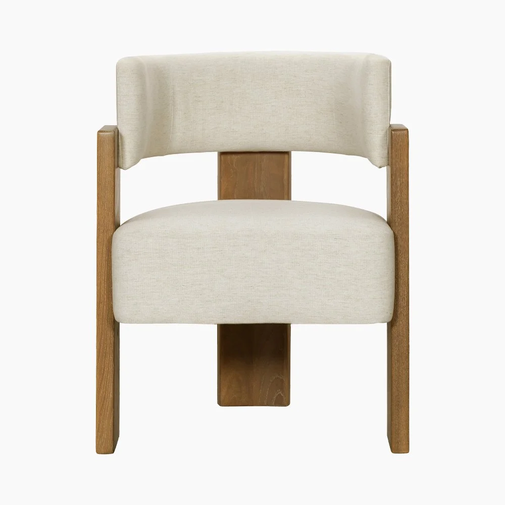 Front view of Carter Dining Chair with neutral linen upholstery and architectural solid oak legs.