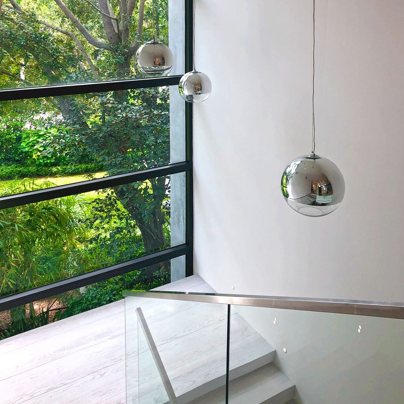 Floating stairs with floor to ceiling windows bringing in the vibrant landscape 🌳
 
#MichaelWolkInteriors #MichaelWolkDesign #WhenDesignMatters #miamirenovation #staircasemakeover #southfloridainteriordesigner #staircaserenovation #southfloridahomes