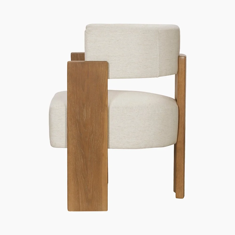 Side profile of sculptural 3-legged dining chair showing the ergonomic curved barrel backrest.