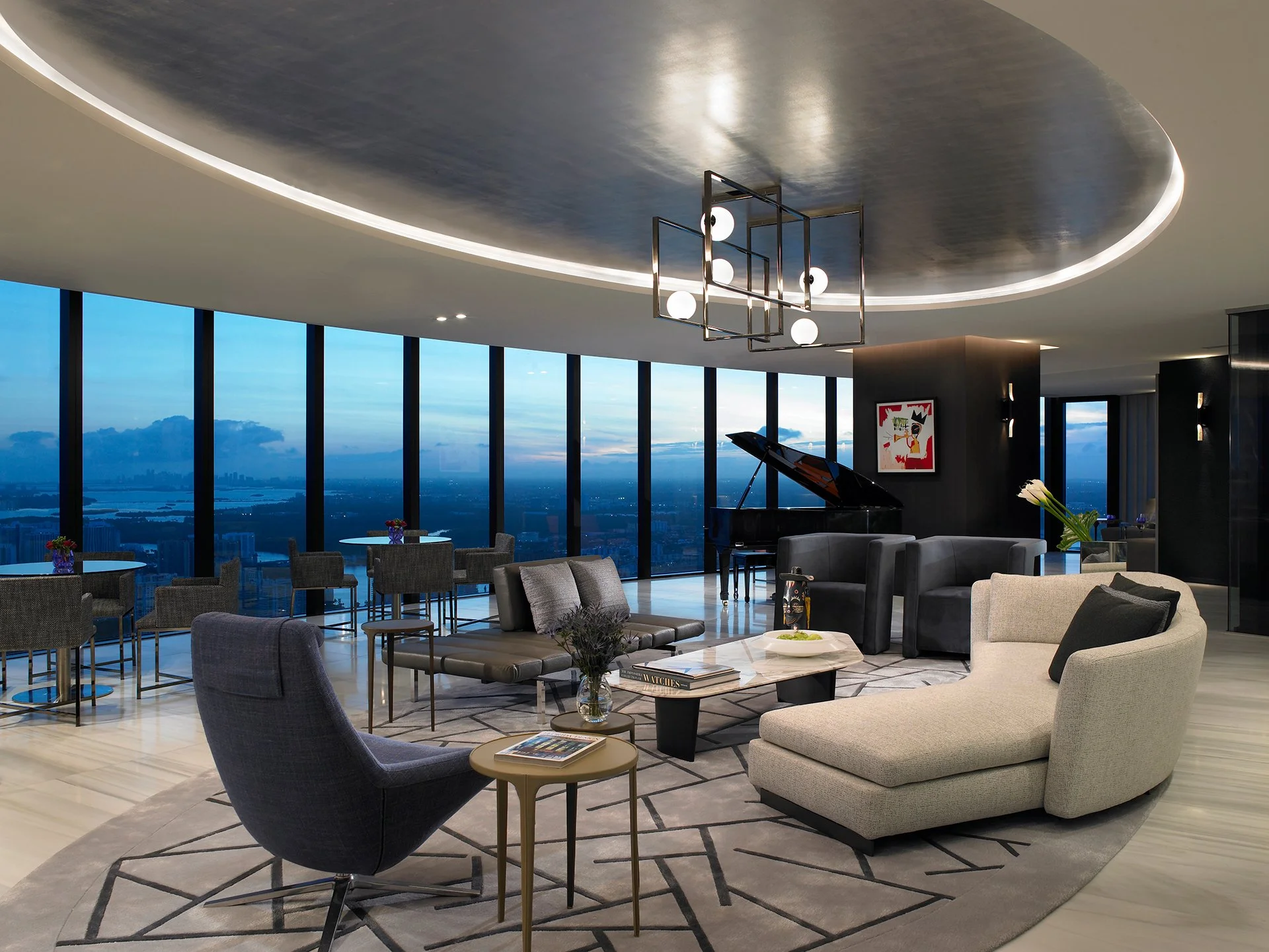 Modern penthouse lounge at dusk, featuring geometric sofas, grand piano, and city skyline.