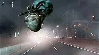 A spaceship crashing onto a city street at night.