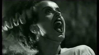 Dark electronica Synth music A woman with her mouth open, appearing to scream, in a black and white photo.