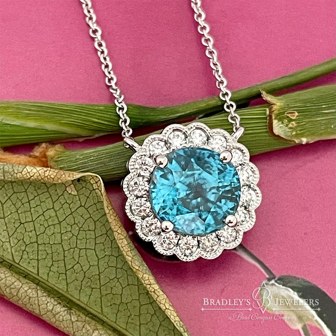 Look at this... 5 carats of bright, enigmatic natural Blue Zircon from Miramar (Burma)! What a WOW gemstone and setting! Our client Cindy took one look at this magnificent necklace and said, &ldquo;Well, that&rsquo;s my favorite color!&rdquo; And jus