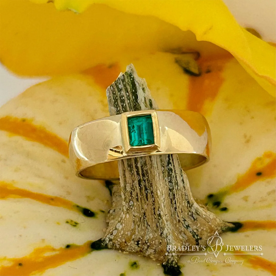 Dominika and her hubby Jack had this beautiful emerald, but it was in a style that just didn&rsquo;t do it justice. She always wanted a classic wide band, but wasn&rsquo;t sure how to set the stone. We had our custom jeweler create this perfect encas