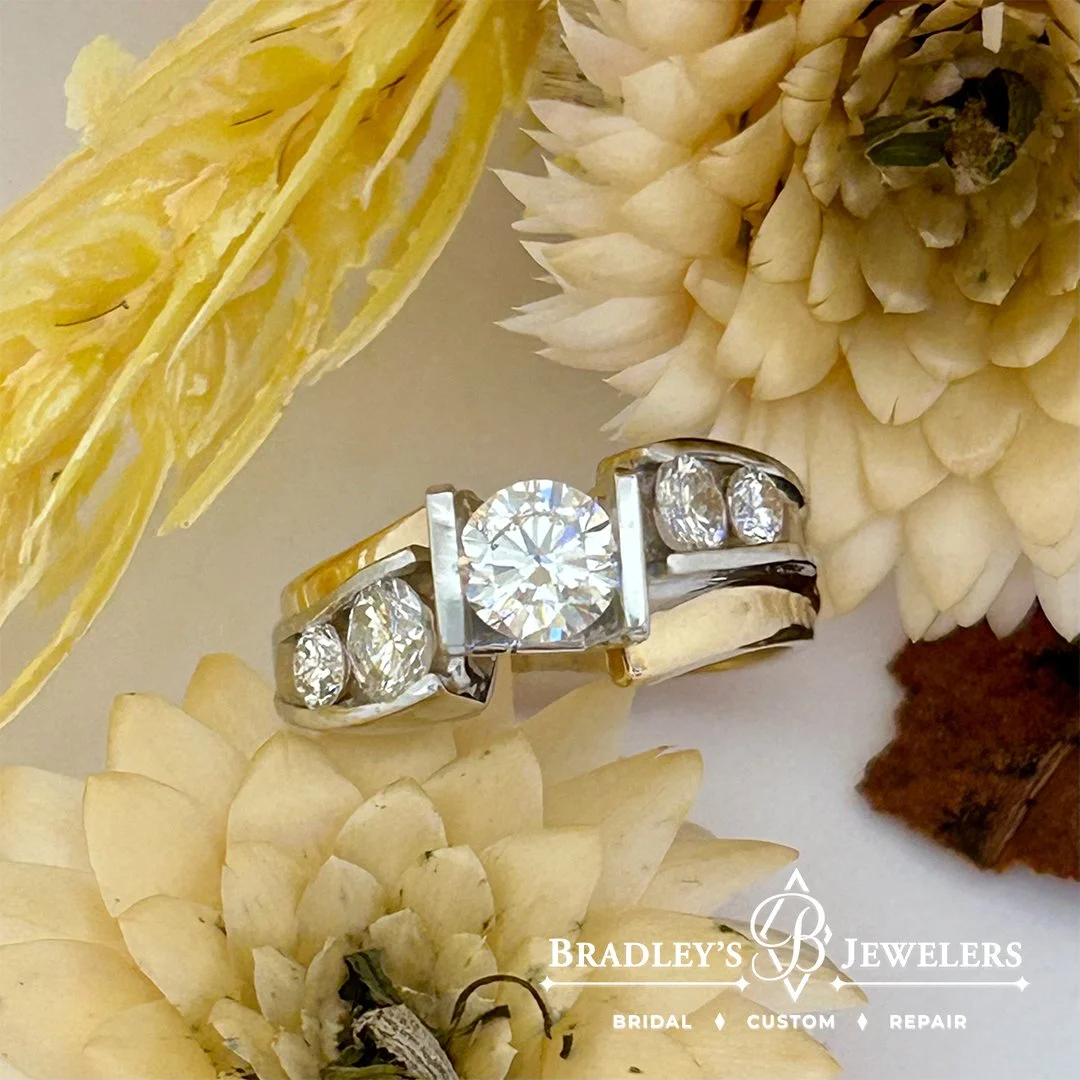 Barb &amp; Dave wanted to add side diamonds to her existing ring. And we suggested remounting her existing prong set center diamond in a custom channel setting. Let&rsquo;s just say there was big time happiness on pick up day! Redesigning a ring make