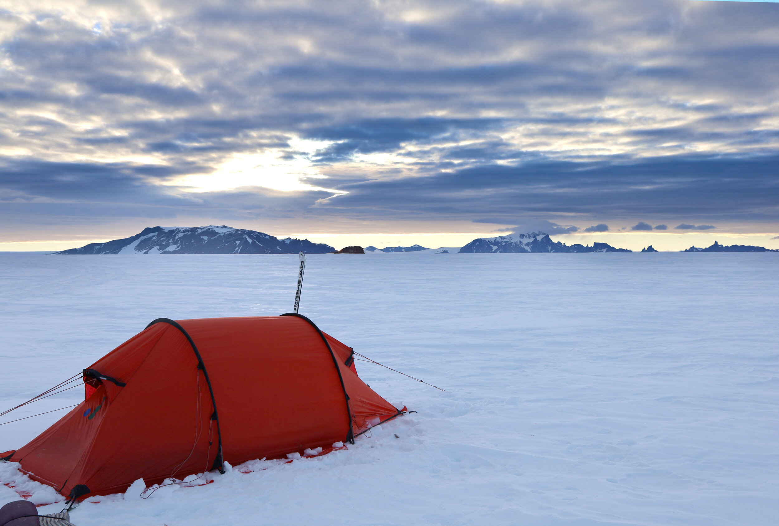 The sun sets on Australian Explorer Geoff Wilson's camp on the Antarctic Plateau.jpg