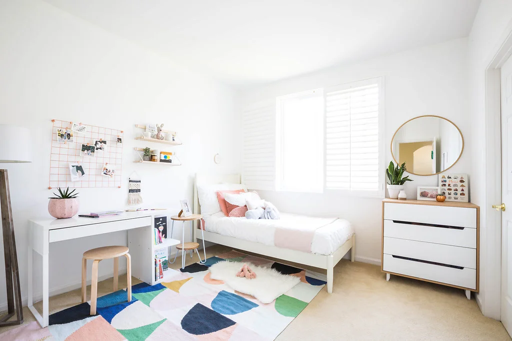 rug (discontinued from land of nod) | sheepskin rug | nightstand (discontinued from UO) | desk (similar) | pink planter