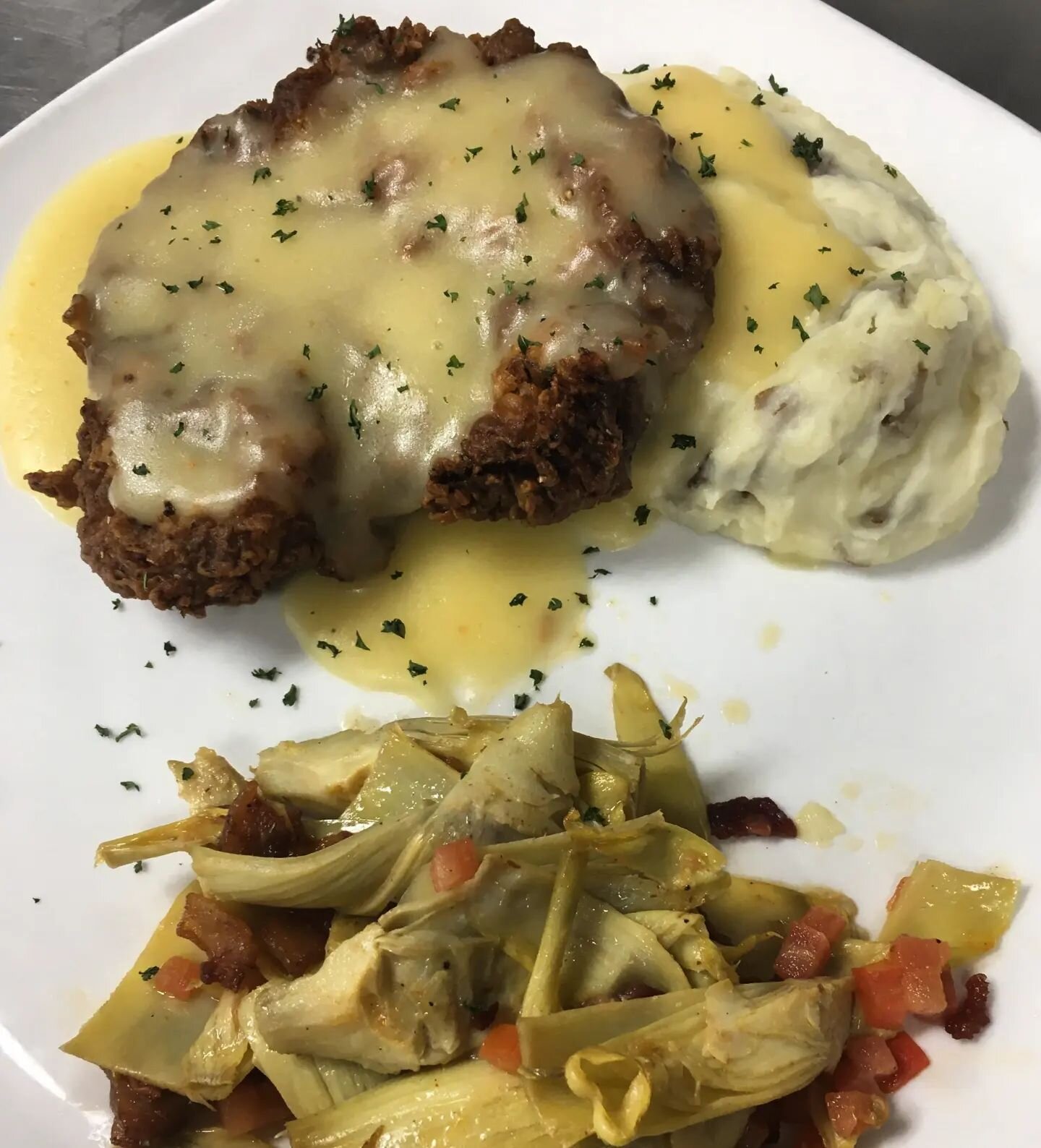 Country fried steak, roasted artichoke, mashed potatoes and gravy