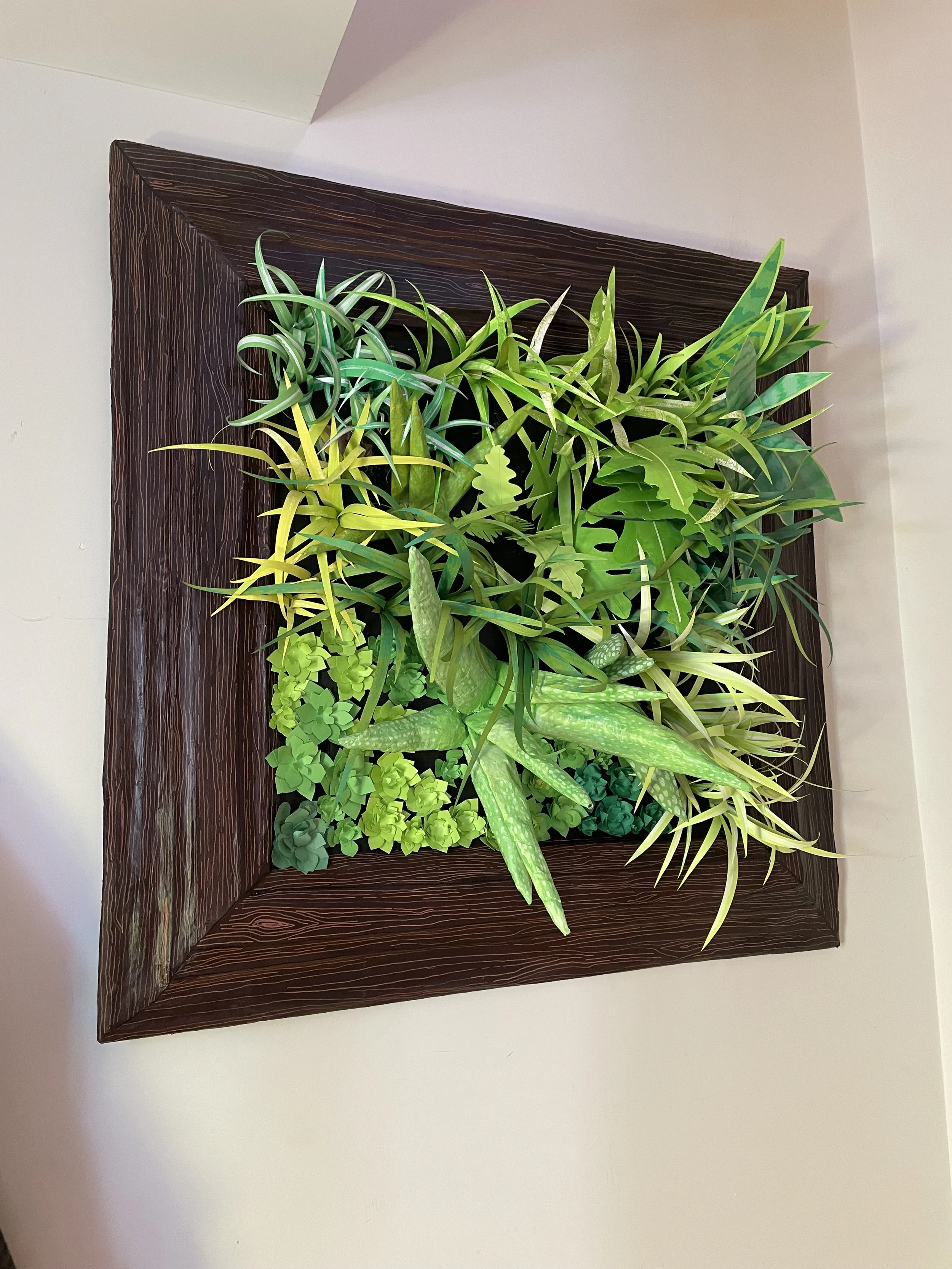  Paper mache frame. Cardboard, masking, tape, paper mache, acrylic paint.  Plants. Cardboard, glue, paper mache, gesso, cardstock, acrylic paint, floral wire. 