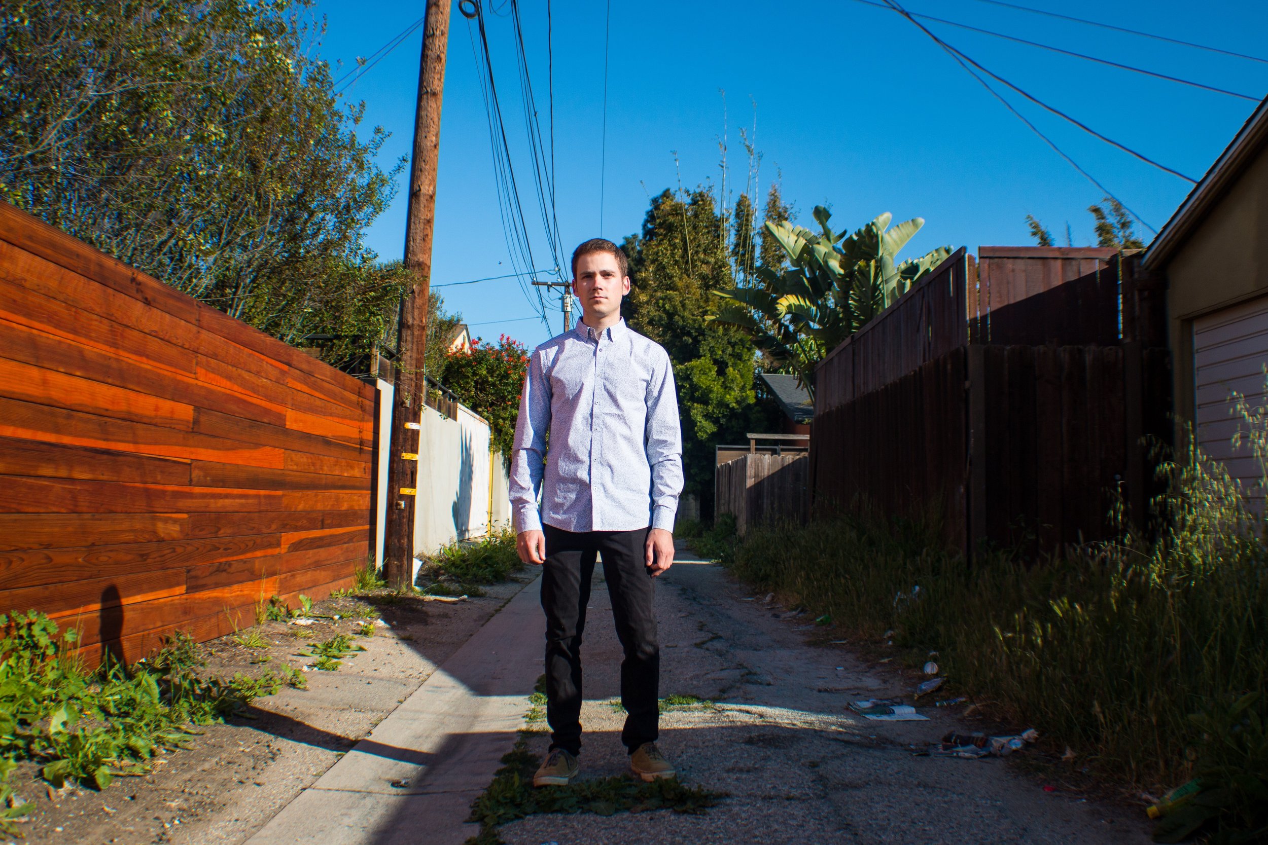 Chris - standing in middle of alley.JPG