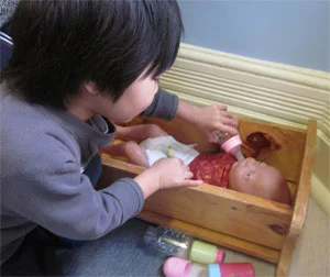 Boy-feeding-baby-small.jpg