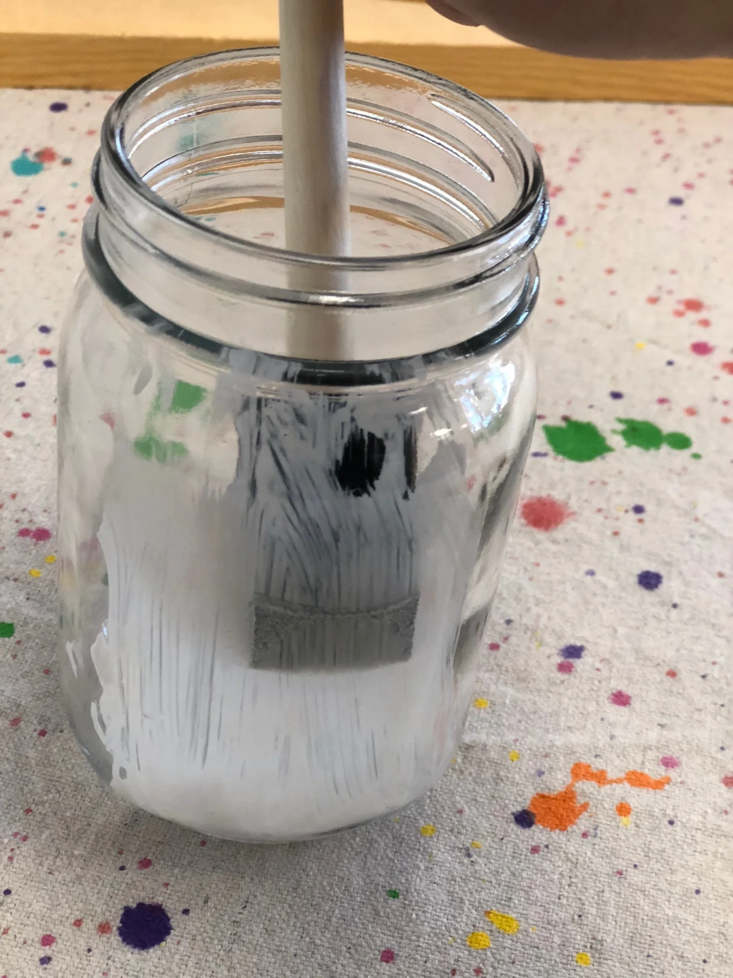 How to make a light up glittery fairy jar lantern. Use a smooth mason jar, glitter, and tea light to make your own light up fairy lantern. Add some floral accents and you have a perfect fairy jar night light for your fairy obsessed little girl.