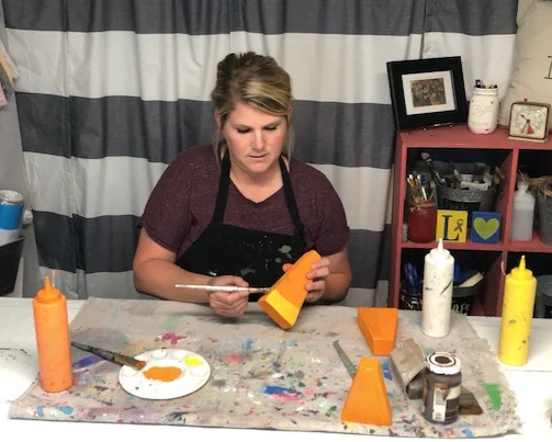 DIY candy corn decorations. How this mom made her own from a scrap 2x4