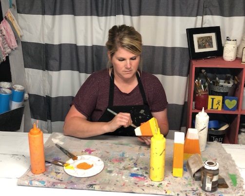 DIY candy corn decorations. How this mom made her own from a scrap 2x4