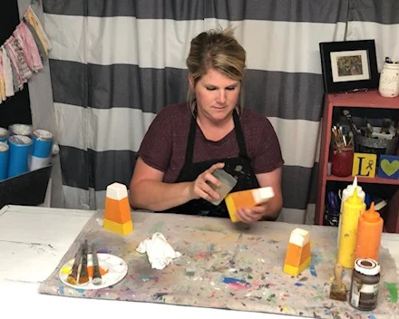 DIY candy corn decorations. How this mom made her own from a scrap 2x4