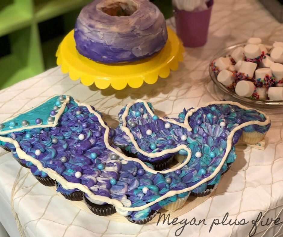 . I used a combination of purple, teal, and white for the frosting colors and I didn’t even use any fancy piping tips {I was a little pressed for time lol}. For under $10 I was able to make the cake of her mermaid themed birthday dreams!