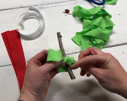 DIY fabric and ribbon Christmas tree ornament. How to make super frugal ornaments for Christmas with your kids. Easy stick tree ornament