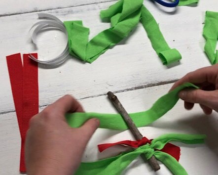 DIY fabric and ribbon Christmas tree ornament. How to make super frugal ornaments for Christmas with your kids. Easy stick tree ornament