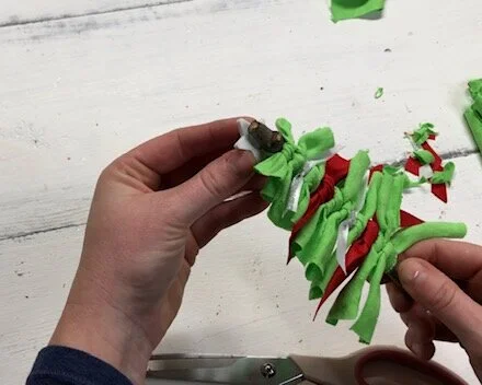 DIY fabric and ribbon Christmas tree ornament. How to make super frugal ornaments for Christmas with your kids. Easy stick tree ornament