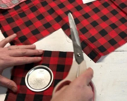 DIY personalized  mason jar lid ornament using buffalo plaid. How to make Christmas ornaments out of rusty canning jar lids and your Cricut