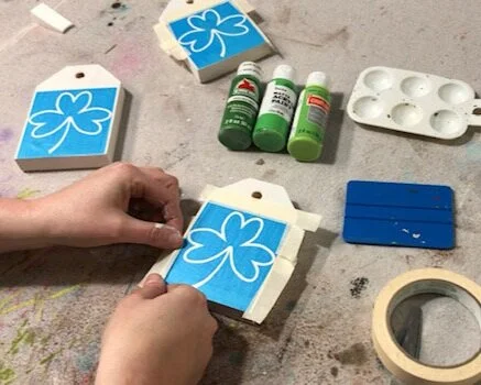 DIY craft kit for adults. How to make mini wood tags for St. Patrick's Day using your Cricut. How to stenicil wood signs for spring.