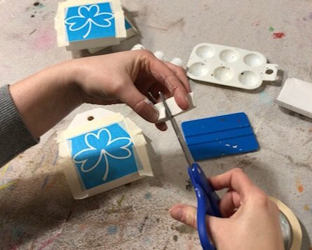 DIY craft kit for adults. How to make mini wood tags for St. Patrick's Day using your Cricut. How to stenicil wood signs for spring.