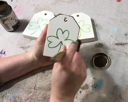 DIY craft kit for adults. How to make mini wood tags for St. Patrick's Day using your Cricut. How to stenicil wood signs for spring. How to apply antiquing wax to wood.